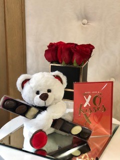 romantic flowers chocolate and teddy bear